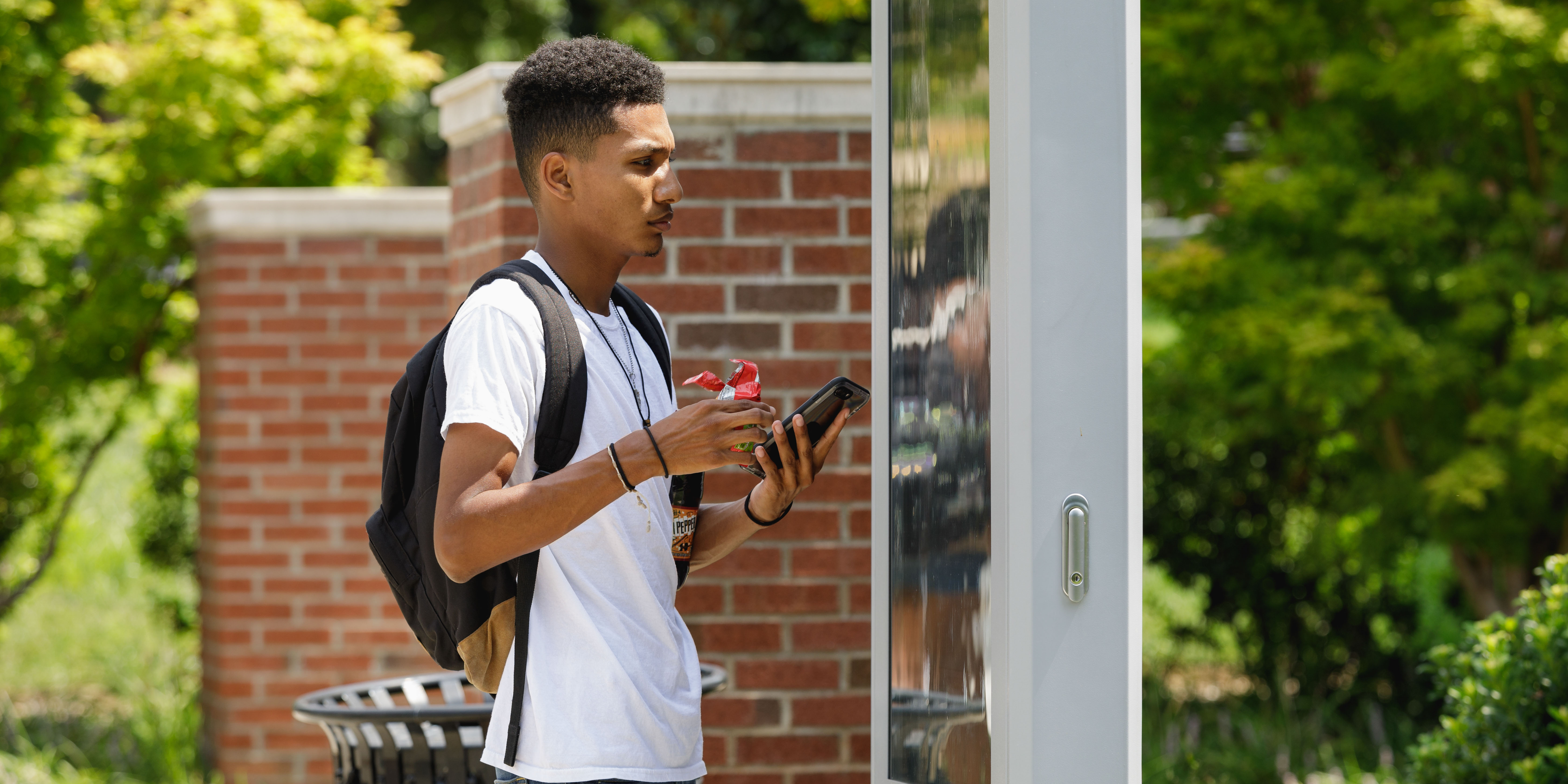 student using map on campus