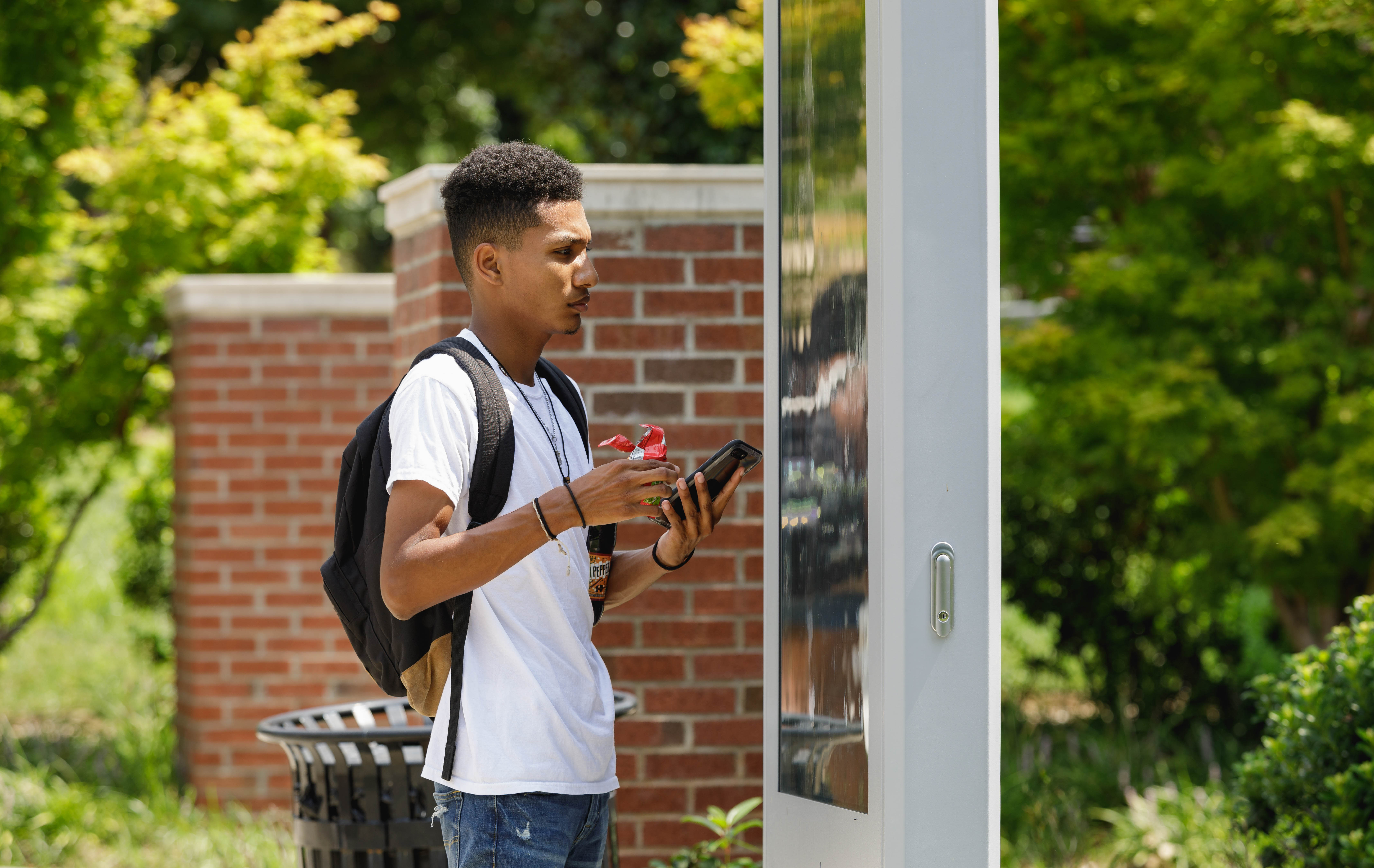 student using map on campus