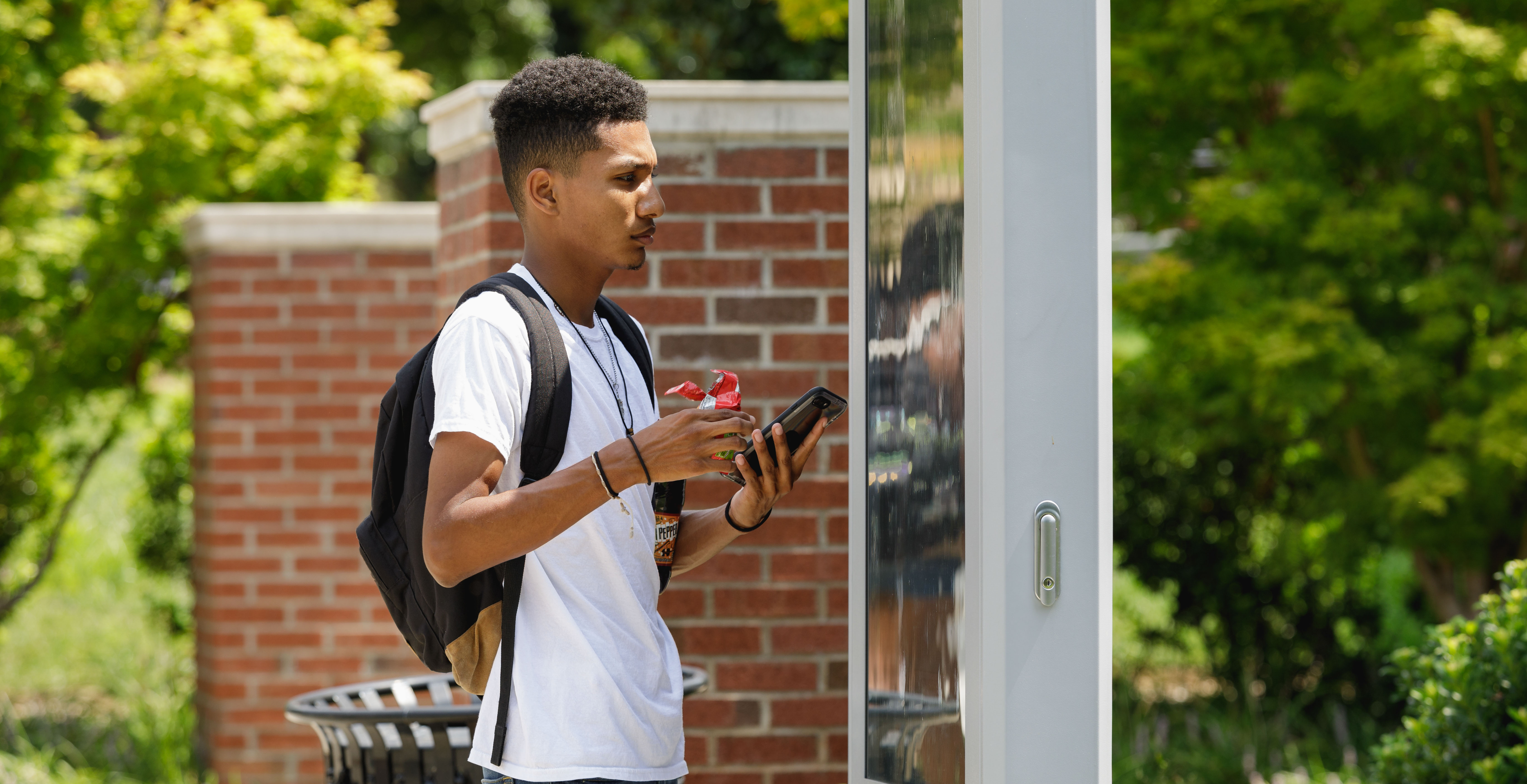 student using map on campus