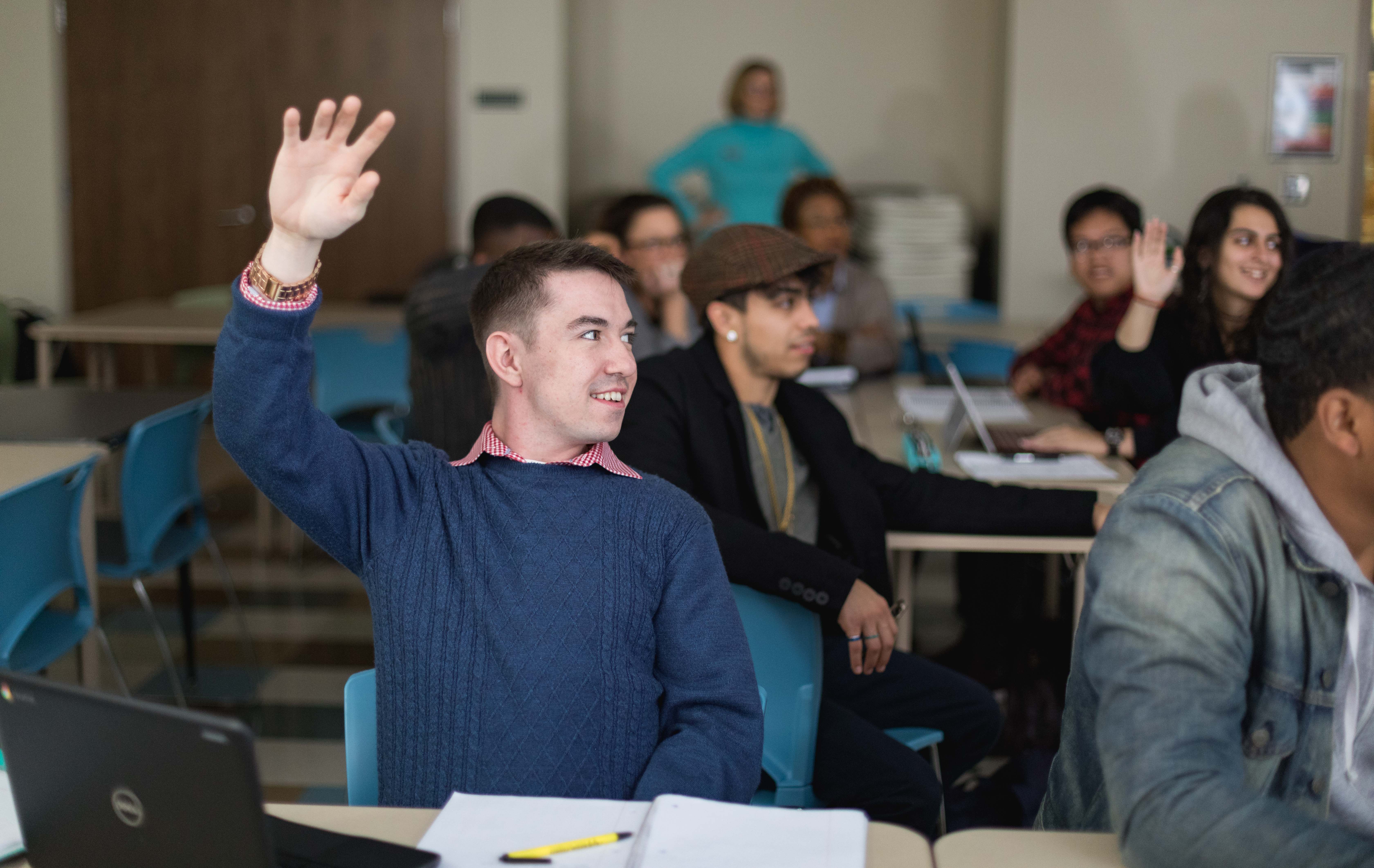 raising hand in classroom