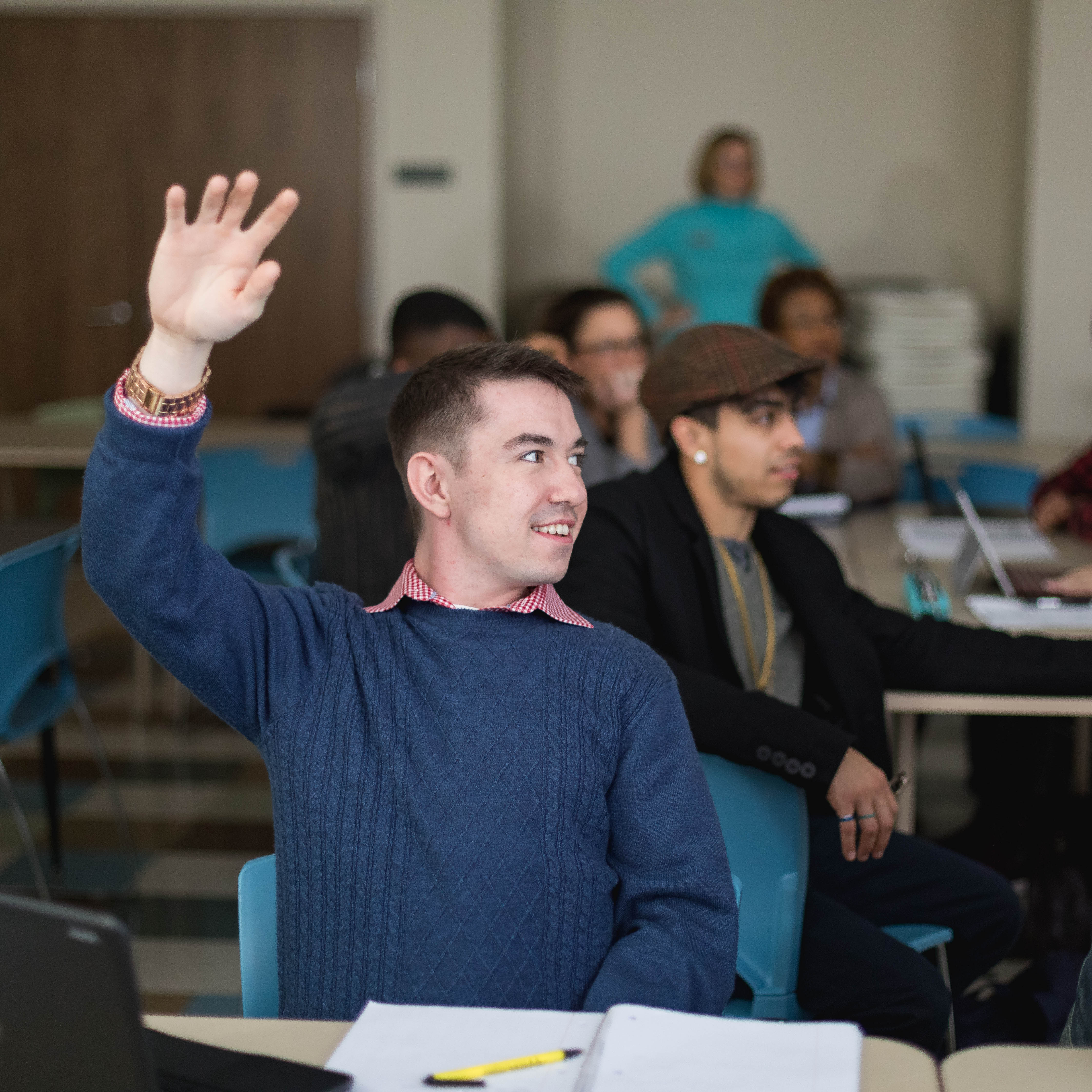 raising hand in classroom