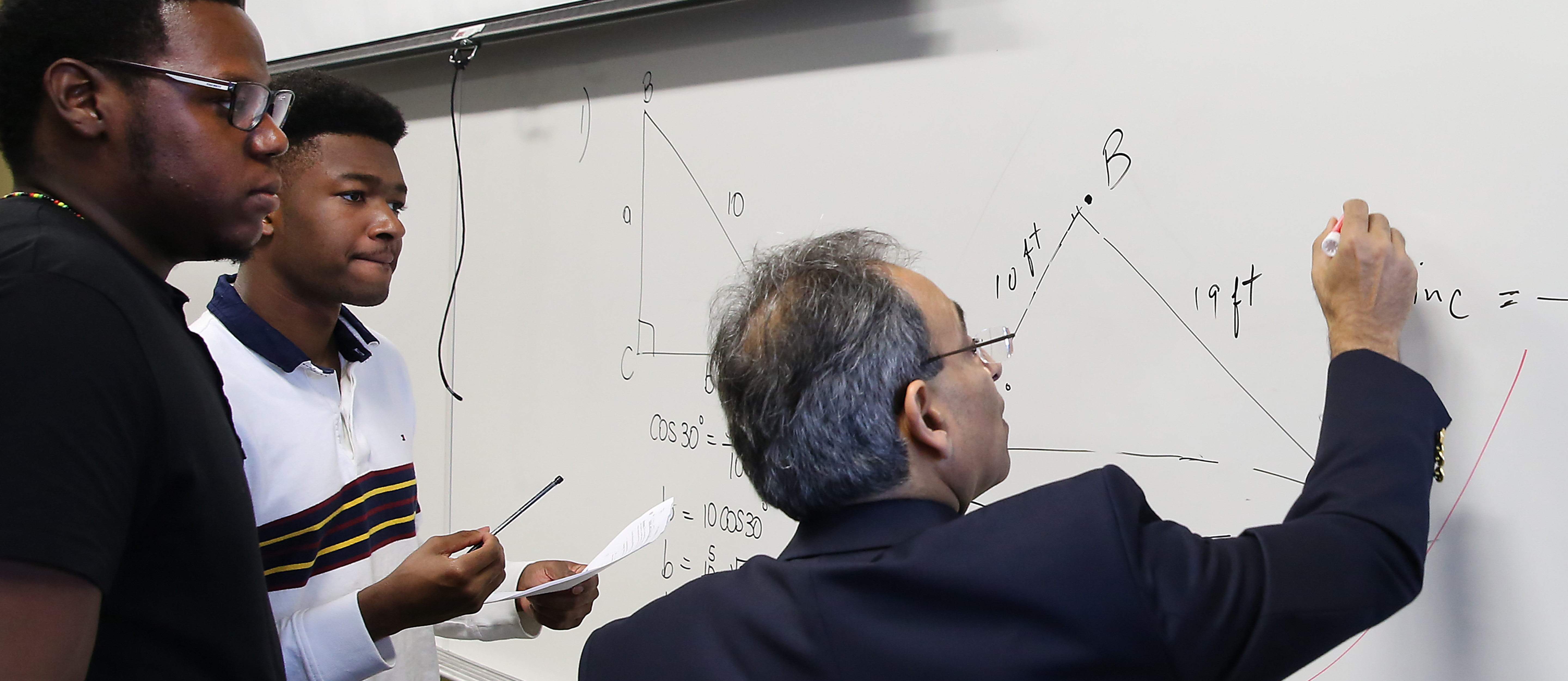 solving problem at whiteboard
