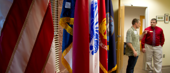 military and veterans event with branch flags