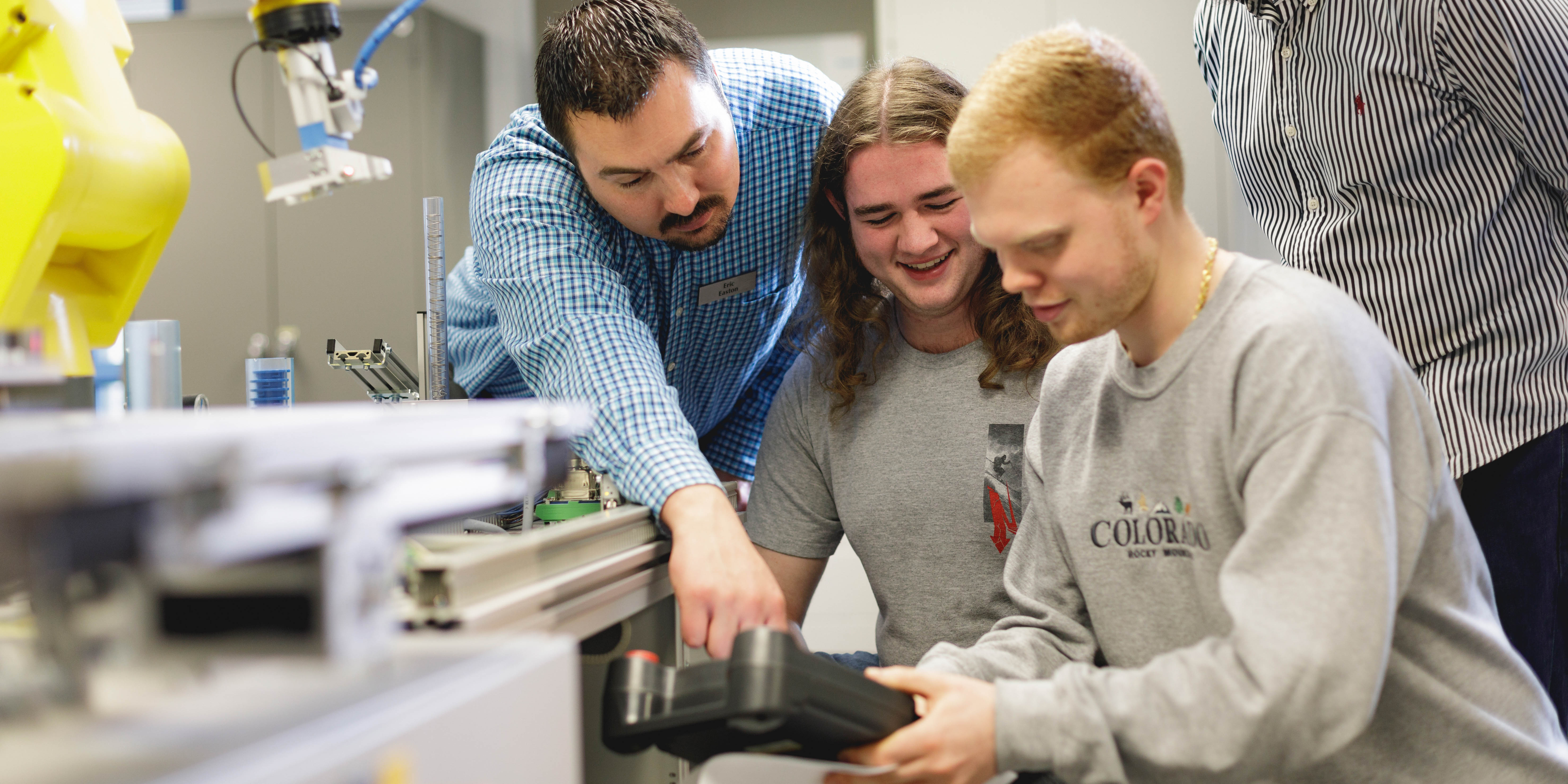 faculty and students working on a project