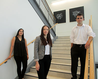 Three Students Standing on Staircase