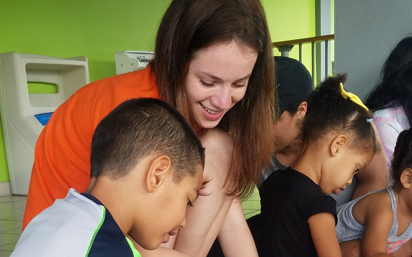 student abroad working with children