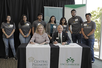 Dr. D and Chancellor from UNC with 49er Next Students