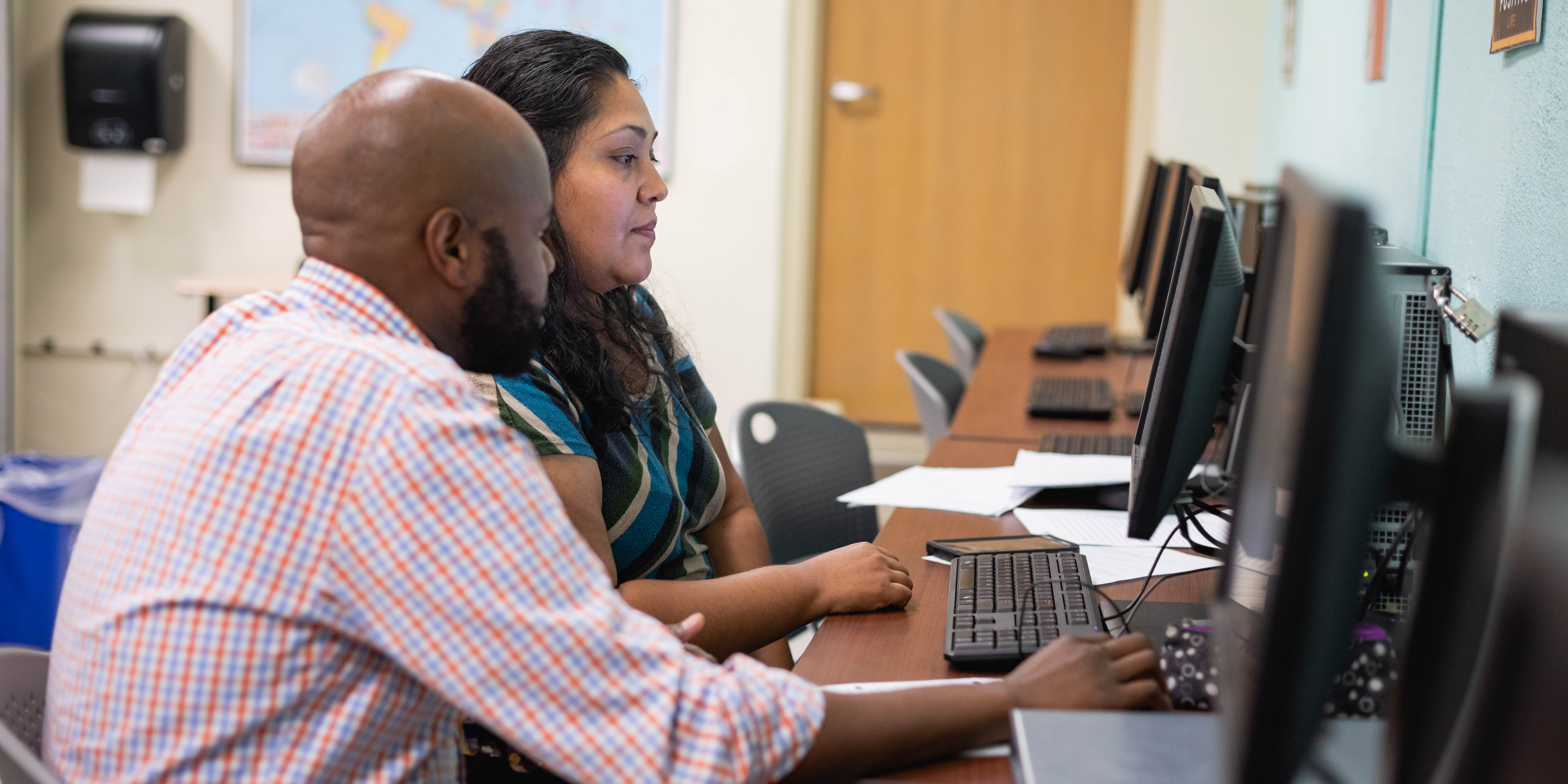 digital marketing Small Business Center students working together on computers 