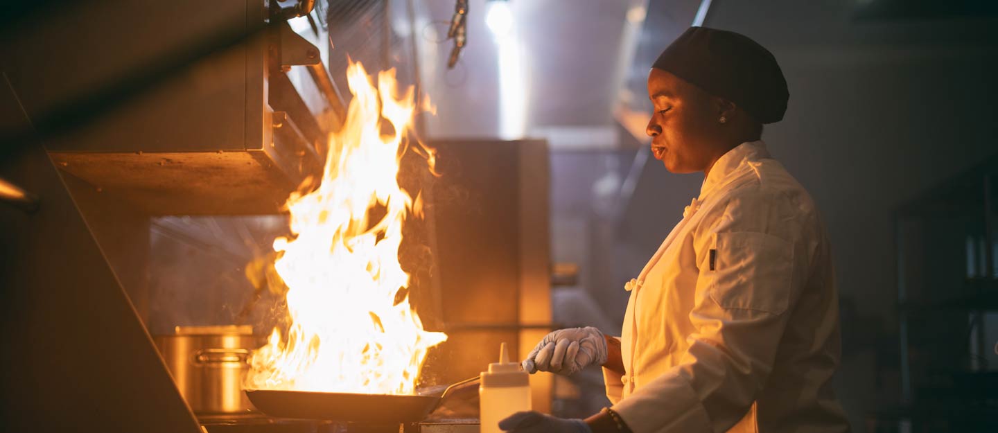 Woman cooking with fire