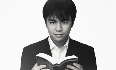 Koichi Takara portrait, holding book