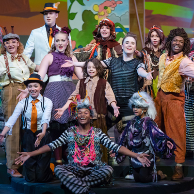 group of young actors on stage in animal costumes for Madagascar Jr. performance