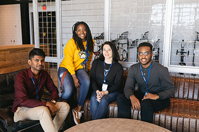 apprentices sitting on Allstate couch