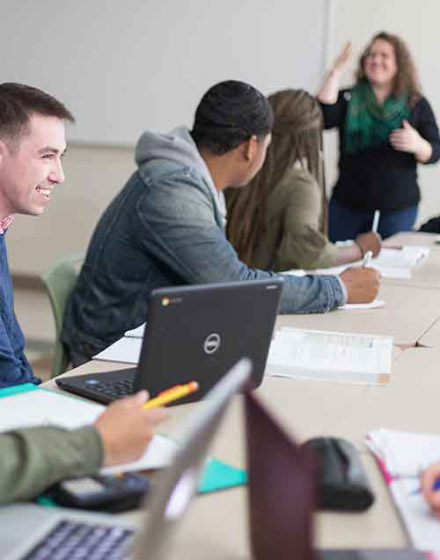 teacher with students in classroom