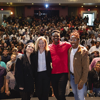 group of students with President Dr. Deitemeyer at a Sensoria event