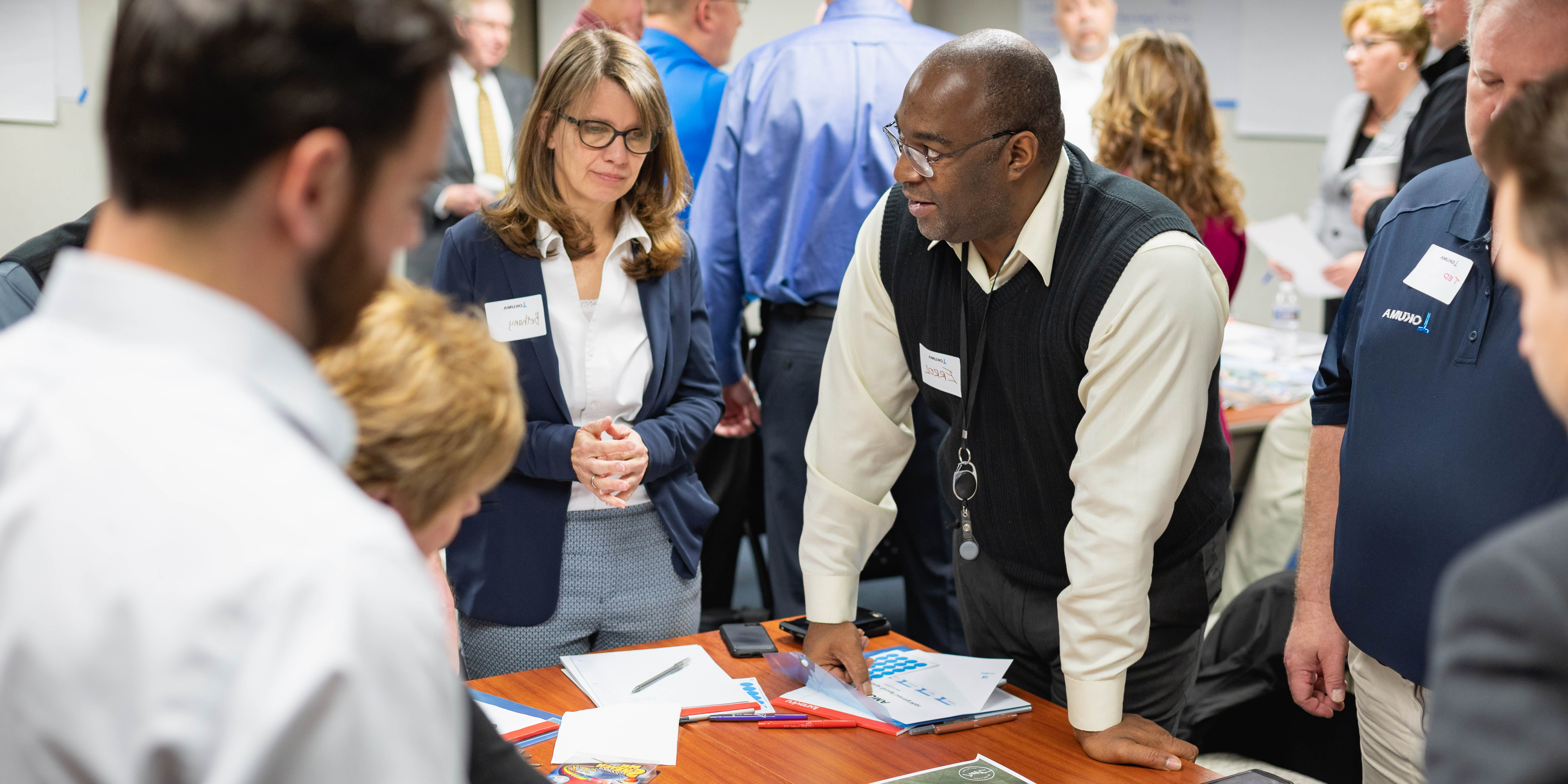 corporate learns discussing a project a round a table