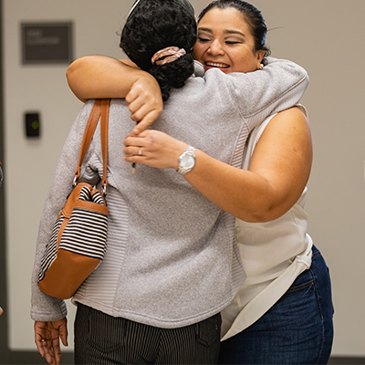 students hugging on first day of class