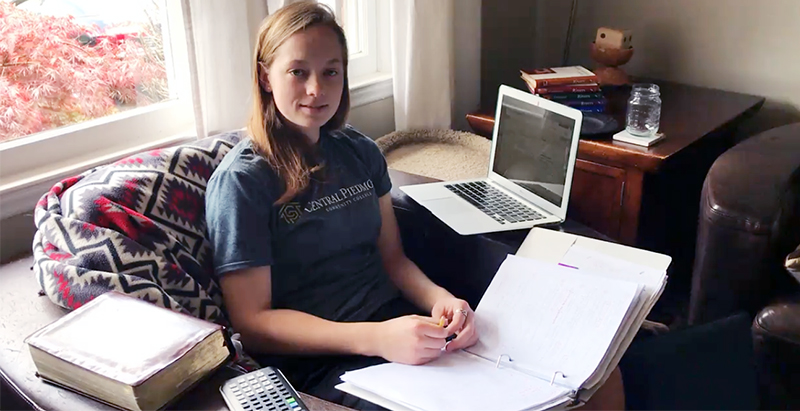 student ambassador Hannahlisa Breakfield in front of laptop