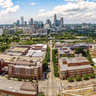 aerial view of Central Campus with Charlotte skyline behind