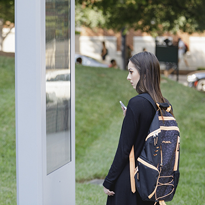 student using map on campus