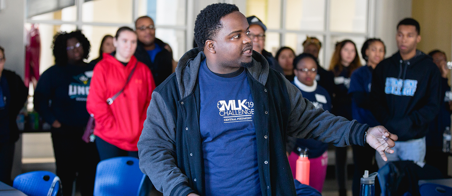 group of students and employees in discussion at MLK Challenge event