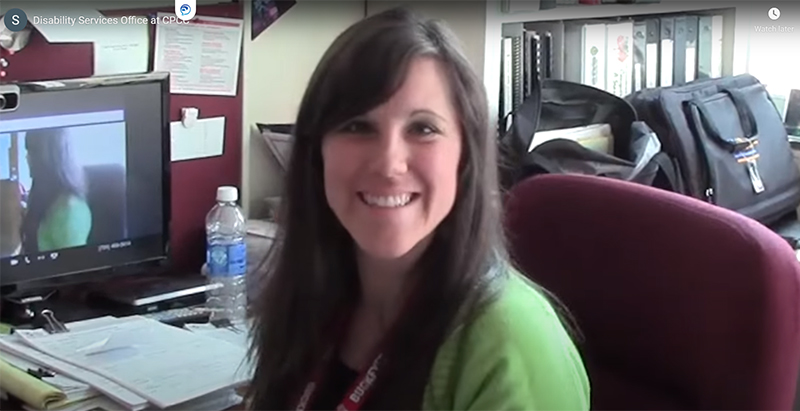 smiling disability services staff member at her desk