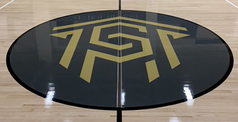 Central Piedmont logo in center of Worrell Gym floor
