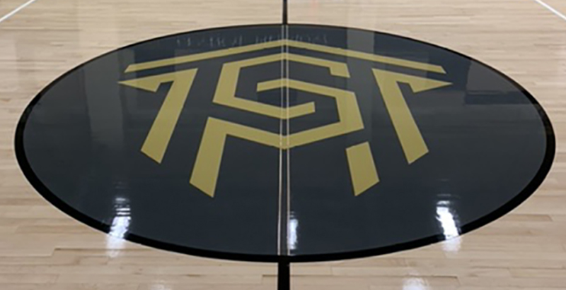 Central Piedmont logo in center of Worrell Gym floor