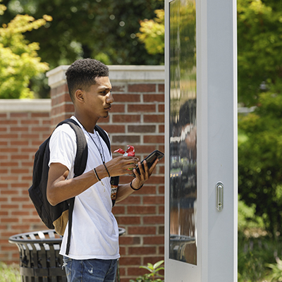 student using map on campus