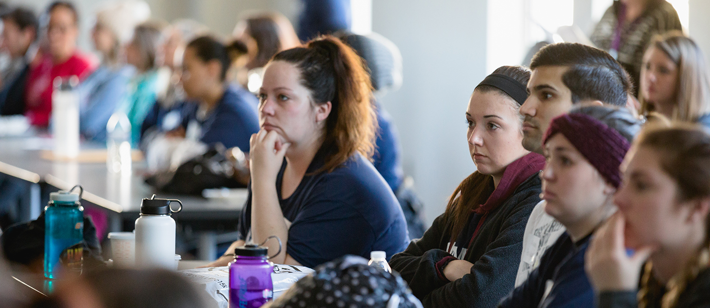 students in classroom listening to speaker