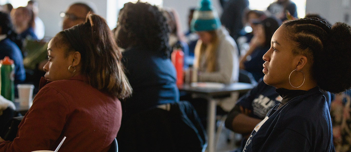 students in classroom listening to speaker