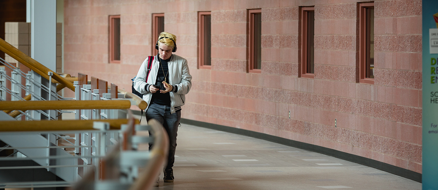 student walking in a hallway at Levine Campus