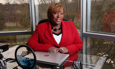 Woman sitting behind desk