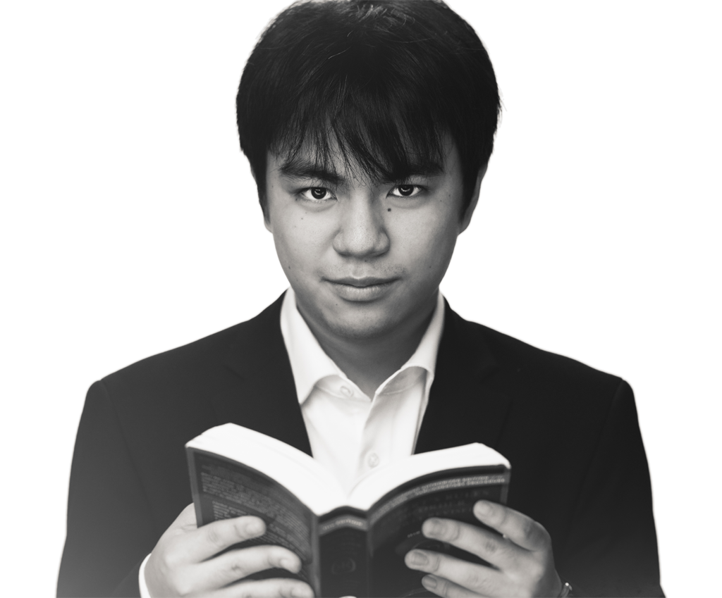 Koichi Takara portrait, holding book