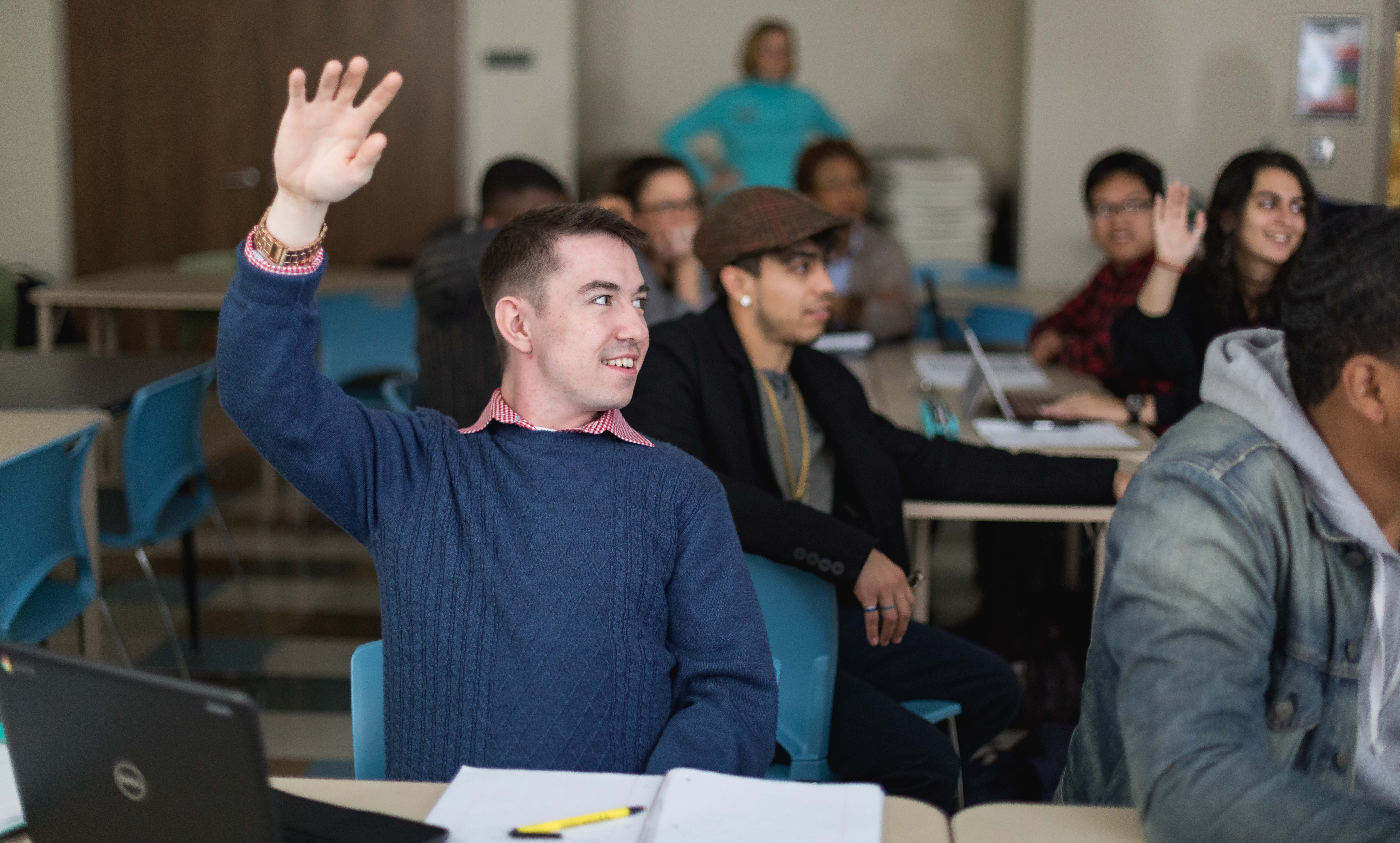 raising hand in classroom