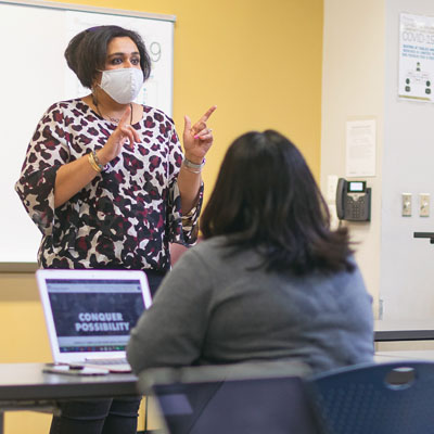 instructor teaching in front of classroom