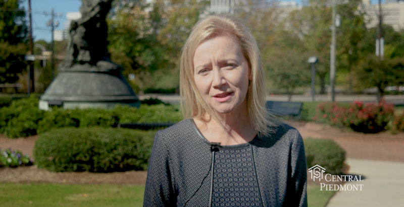 Central Piedmont President Dr. Deitemeyer in front of park near Central Campus