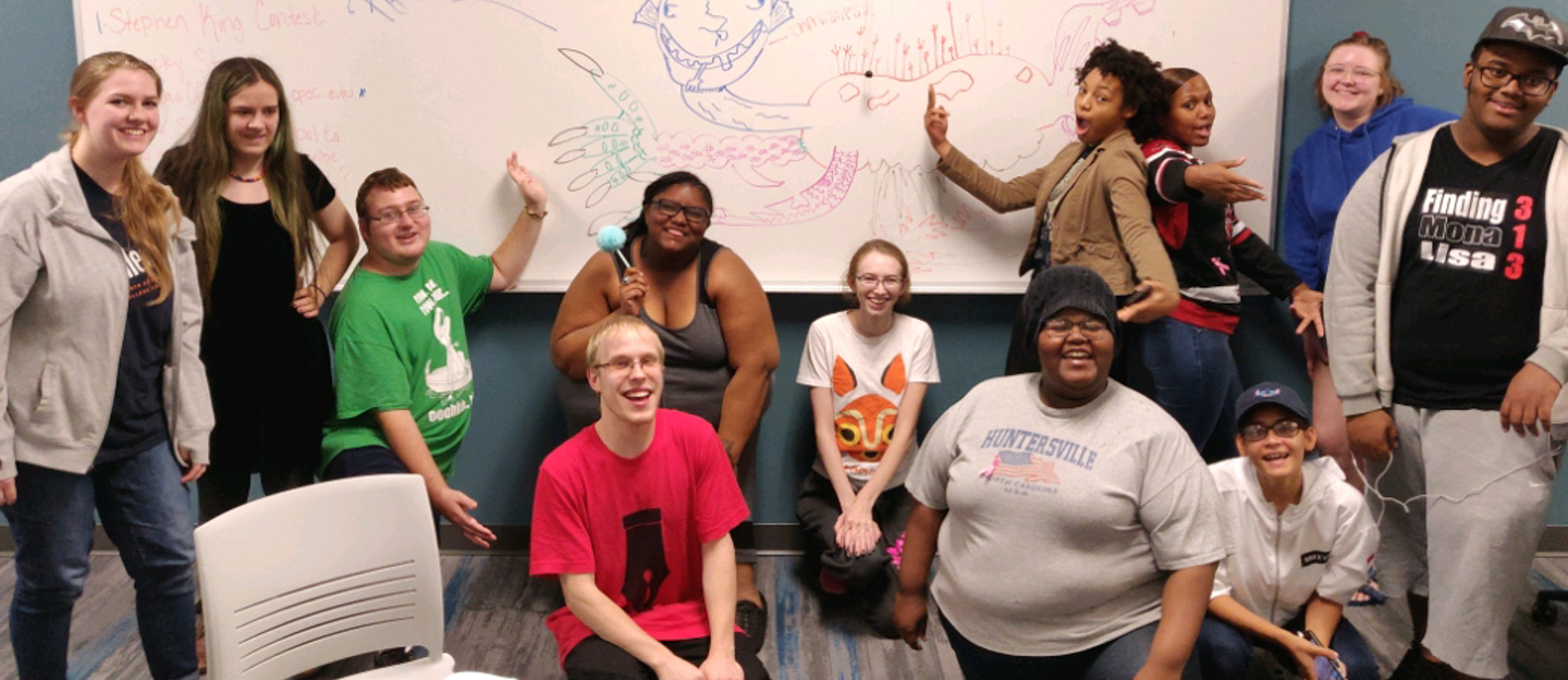 group of diverse students at poetry reading