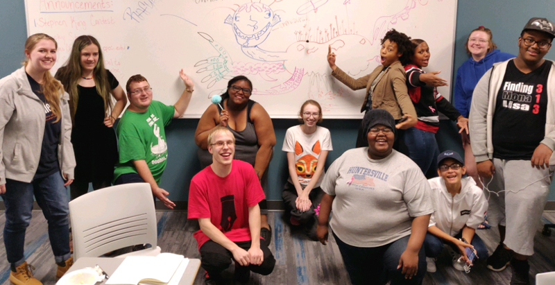 group of diverse students at poetry reading