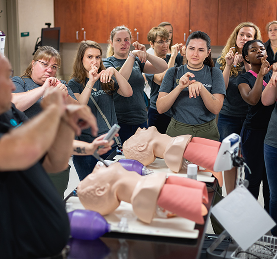 diverse group of Central Piedmont interpreter education students learning ASL signs