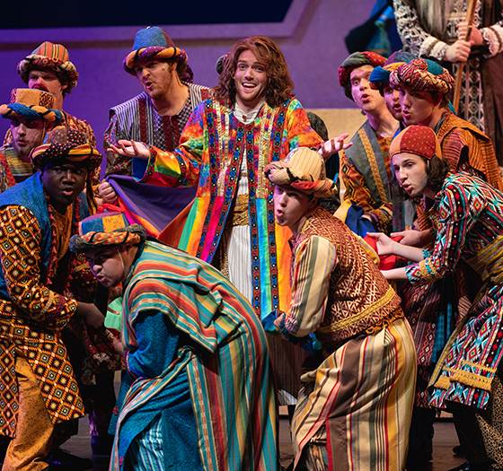 production of Joseph and the telecolor dream coat; Joseph character surrounded by his brothers