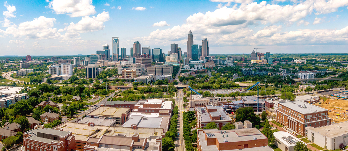 aerial view of Central Campus with Charlotte skyline behind