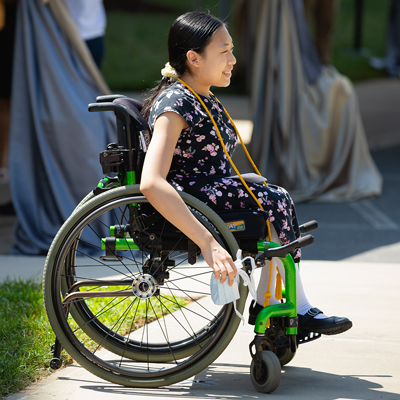 student in wheelchair at Central Piedmont graduation