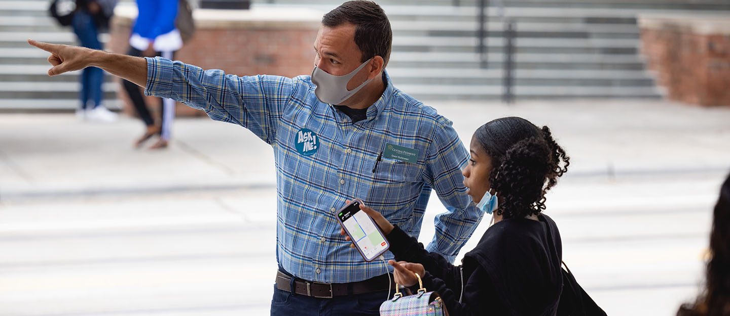 Professor Owen Sutkowski helping direct a student to a Central Campus building on the first day of classes