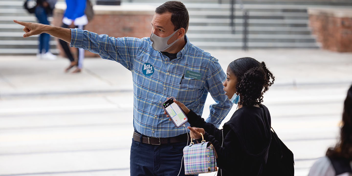 Professor Owen Sutkowski helping direct a student to a Central Campus building on the first day of classes