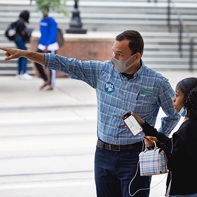 Professor Owen Sutkowski helping direct a student to a Central Campus building on the first day of classes