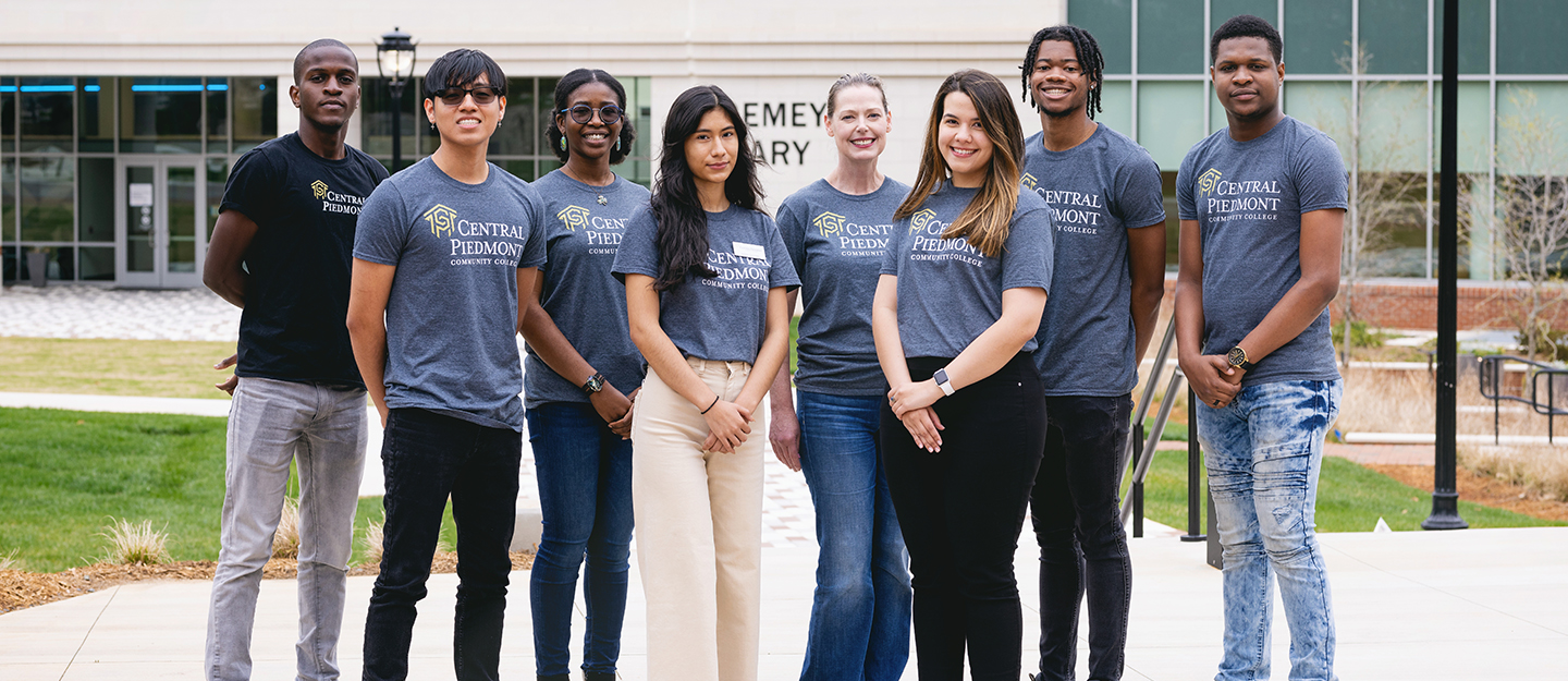 group of student ambassadors standing in front of new student success center