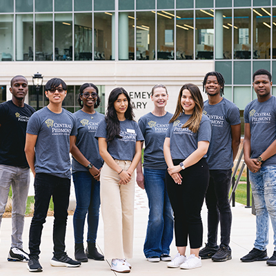 group of student ambassadors standing in front of new student success center