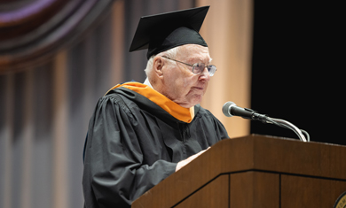 Mr. Parr at podium at graduation