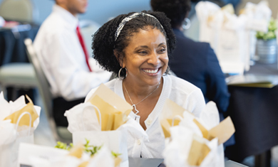 CMS employee sitting at table