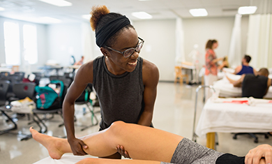 Massage Therapy Student Working on a Patient's Leg